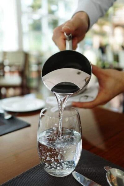 Photo by Pixabay Person Pouring Water on Glass